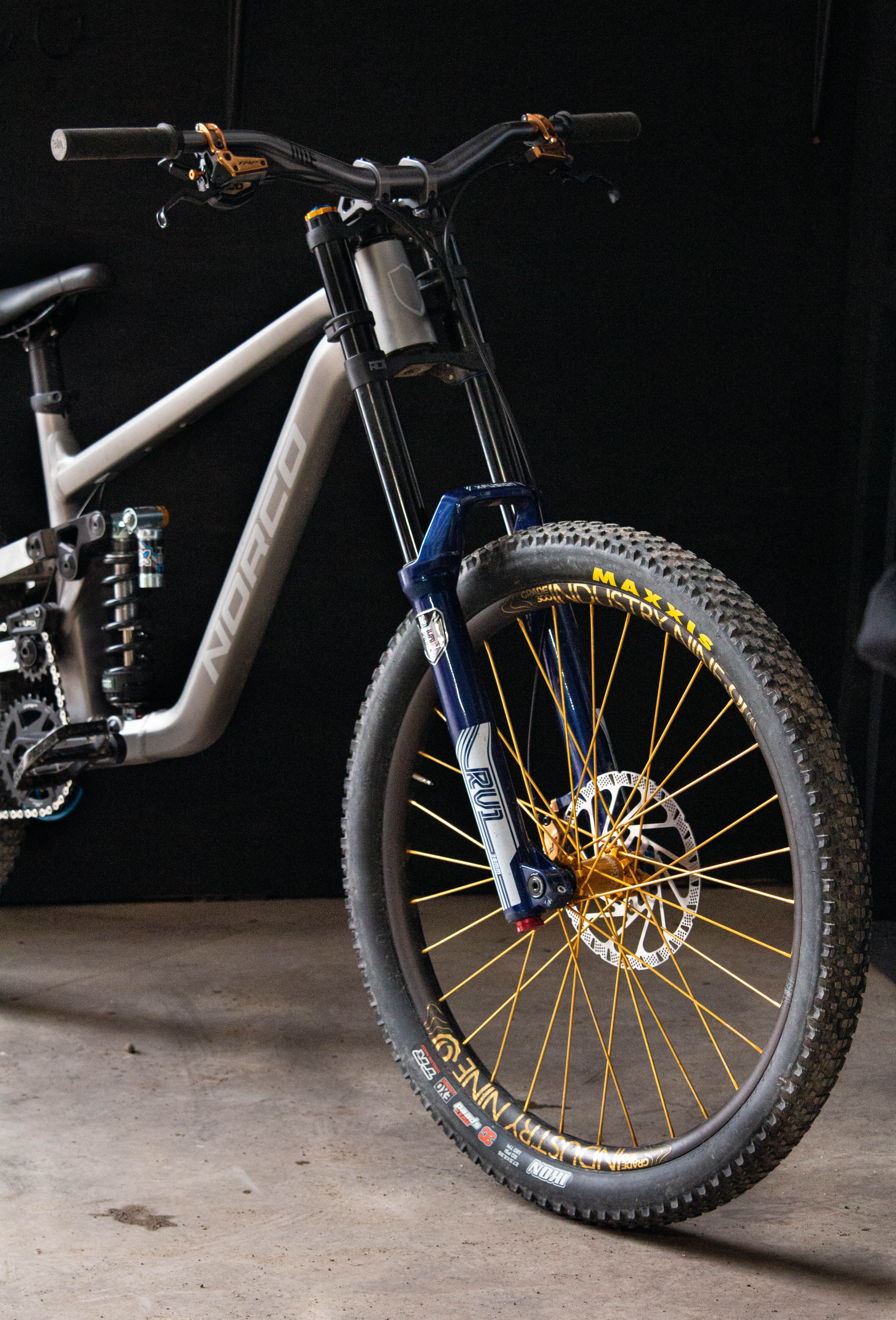 Mountain bike with suspension fork on a dark background