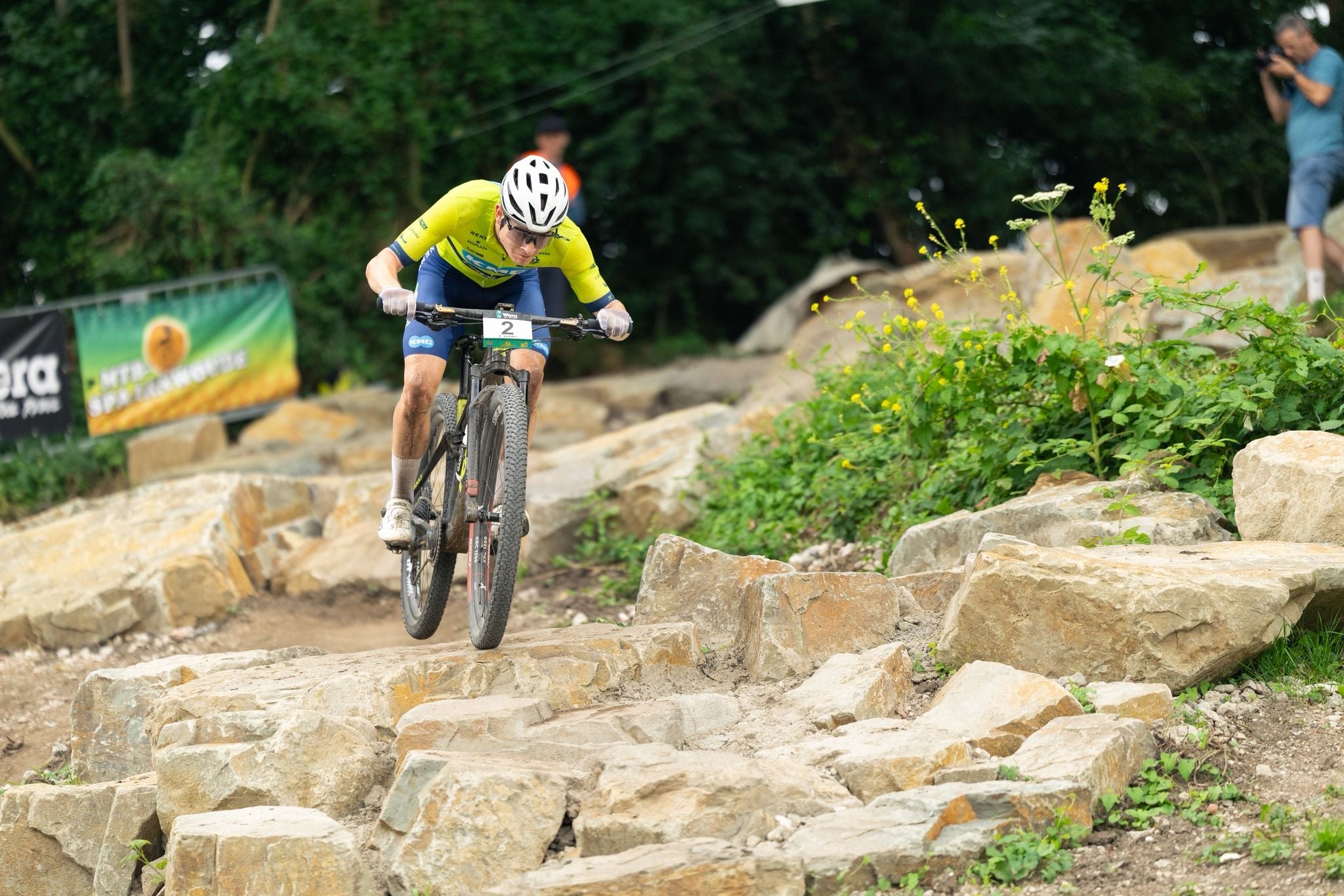 Mountain bike racer on a rocky path